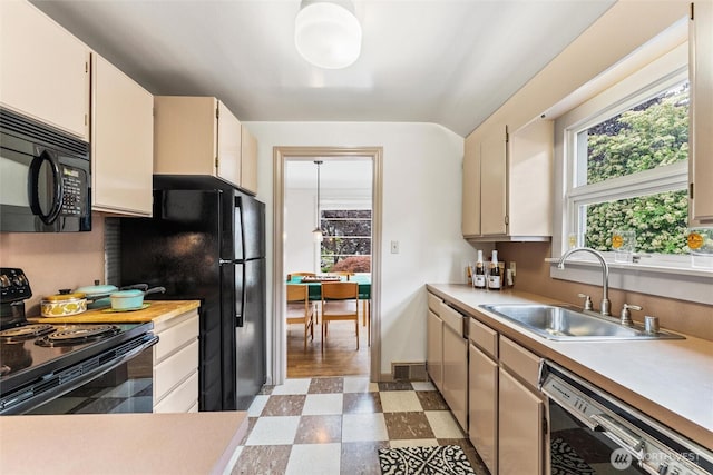 1327 N 79th St, Seattle, WA 98103 - kitchen with black appliances, light floors, and light countertops