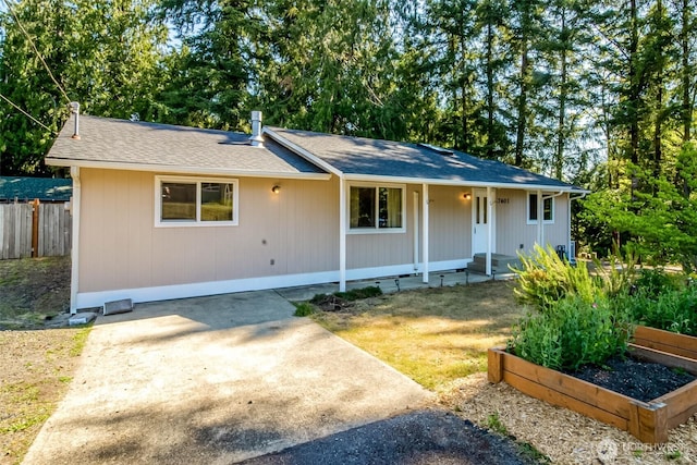 7601 Greenridge Loop SW, Olympia, WA 98512 - view of front facade featuring a vegetable garden and roof with shingles