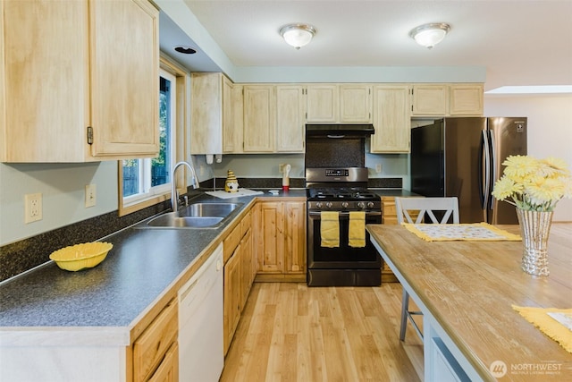 7601 Greenridge Loop SW, Olympia, WA 98512 - kitchen featuring range with gas stovetop, freestanding refrigerator, dishwasher, light wood-style flooring, and under cabinet range hood