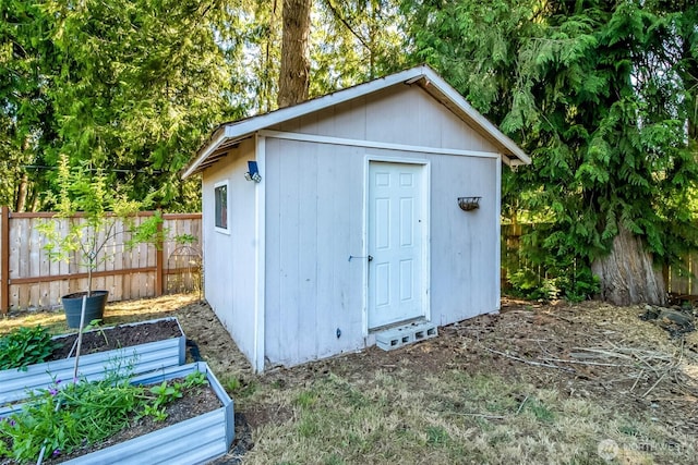 7601 Greenridge Loop SW, Olympia, WA 98512 - view of shed featuring a garden and a fenced backyard