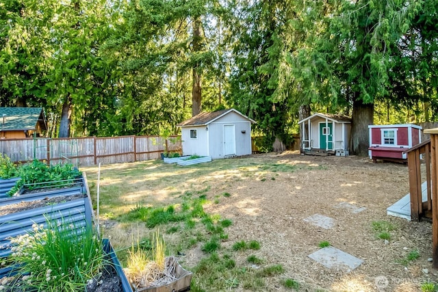 7601 Greenridge Loop SW, Olympia, WA 98512 - view of yard featuring a storage shed and a vegetable garden
