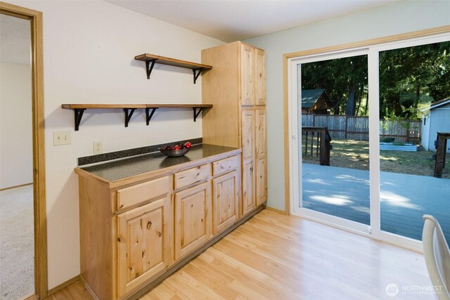 7601 Greenridge Loop SW, Olympia, WA 98512 - kitchen featuring open shelves, light brown cabinetry, dark countertops, and light wood-type flooring