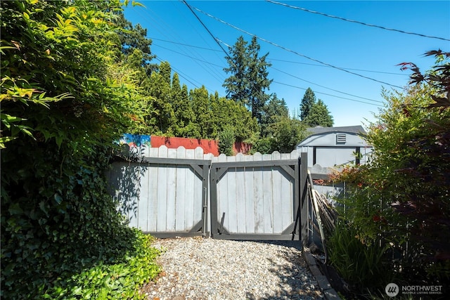717 Cushing St SW, Olympia, WA 98502 - gate featuring a storage shed
