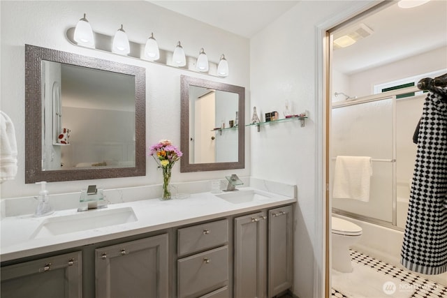 717 Cushing St SW, Olympia, WA 98502 - bathroom featuring double vanity and enclosed tub / shower combo