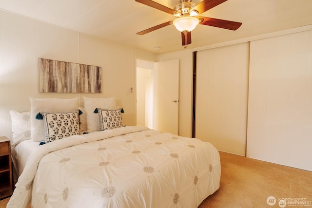 1121 244th St SW Unit 49, Bothell, WA 98021 - bedroom with light carpet, a closet, and a ceiling fan