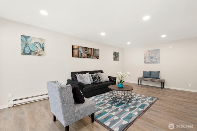 12700 NE 8th St Unit E-205, Bellevue, WA 98005 - living room with baseboard heating, wood finished floors, and recessed lighting