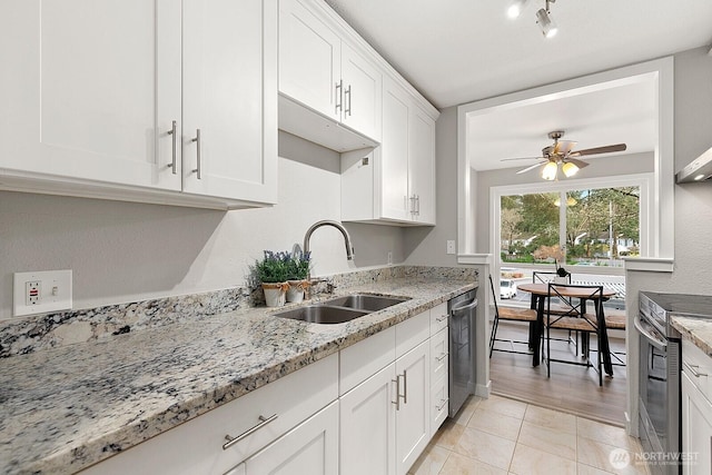 12700 NE 8th St Unit E-205, Bellevue, WA 98005 - kitchen with appliances with stainless steel finishes, ceiling fan, white cabinetry, and light stone countertops