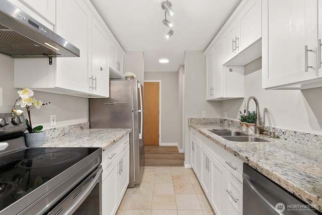 12700 NE 8th St Unit E-205, Bellevue, WA 98005 - kitchen featuring under cabinet range hood, stainless steel appliances, white cabinets, light stone counters, and light tile patterned floors