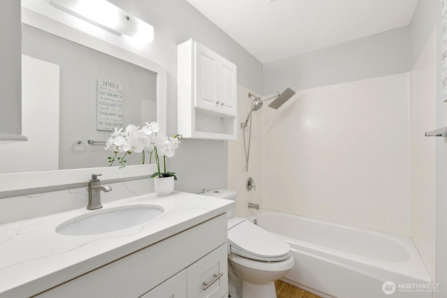 12700 NE 8th St Unit E-205, Bellevue, WA 98005 - full bathroom with vanity,  shower combination, and wood finished floors