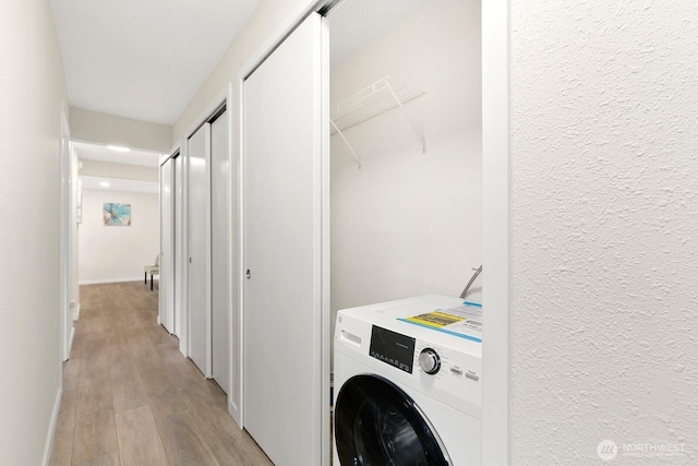 12700 NE 8th St Unit E-205, Bellevue, WA 98005 - laundry area featuring washer / clothes dryer and light wood-style flooring