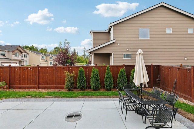 1423 Cascade St, Sultan, WA 98294 - fenced backyard with a patio area, outdoor dining space, and a residential view