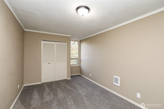 1514 Mt Brynion Rd, Kelso, WA 98626 - unfurnished bedroom with dark colored carpet, a closet, and ornamental molding