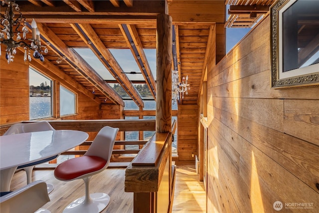 3123 Fairview Ave E Unit 2, Seattle, WA 98102 - dining space featuring wood walls, light wood-style floors, wood ceiling, and a water view