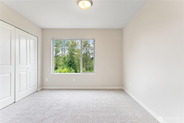 4239 NE 3rd Ln, Renton, WA 98059 - unfurnished bedroom featuring carpet flooring and a closet