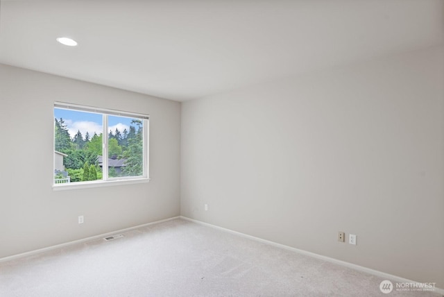 14691 NE 16th St, Bellevue, WA 98007 - carpeted spare room featuring baseboards and recessed lighting