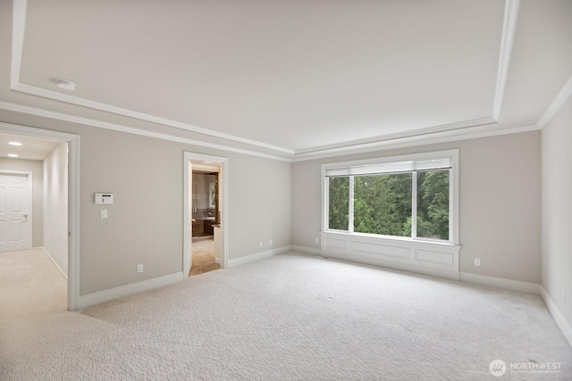 14691 NE 16th St, Bellevue, WA 98007 - empty room with ornamental molding, light colored carpet, a smoke detector, and a tray ceiling