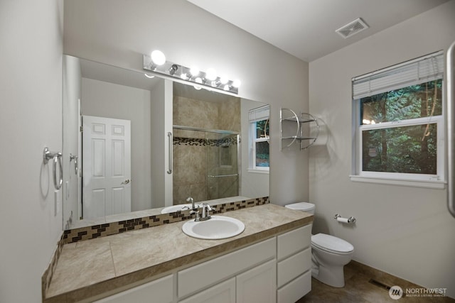 14691 NE 16th St, Bellevue, WA 98007 - bathroom featuring a tile shower, plenty of natural light, and vanity