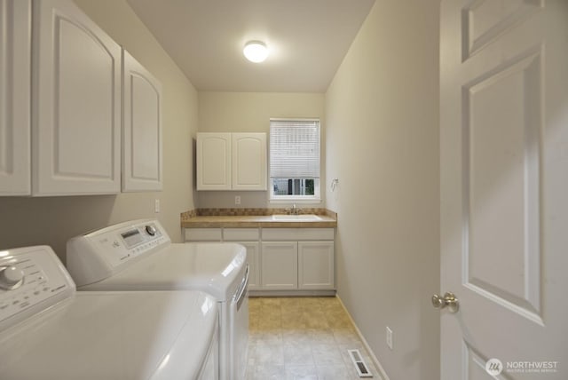 14691 NE 16th St, Bellevue, WA 98007 - laundry room with separate washer and dryer and cabinet space