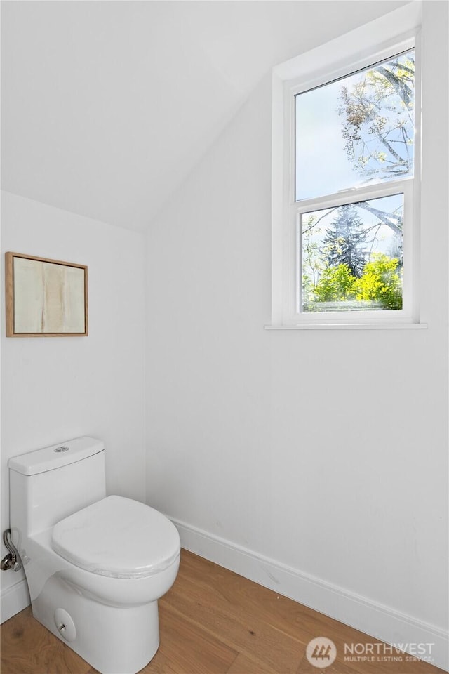 10520 NE 111th Pl, Kirkland, WA 98033 - bathroom featuring vaulted ceiling and wood finished floors
