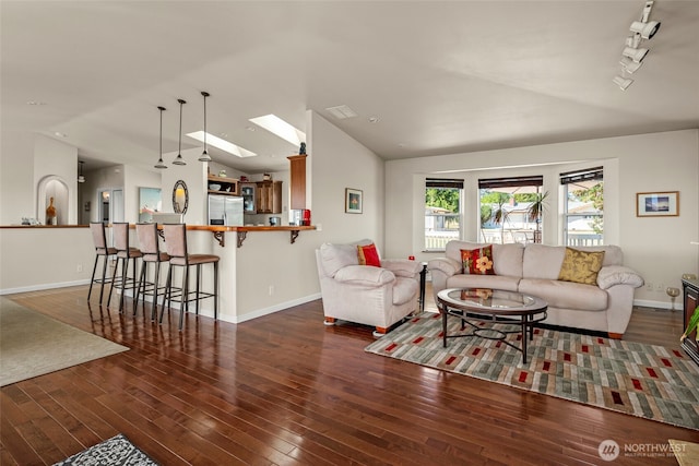1223 Rainier Ln, Oak Harbor, WA 98277 - living room with vaulted ceiling, wood-type flooring, a skylight, and rail lighting