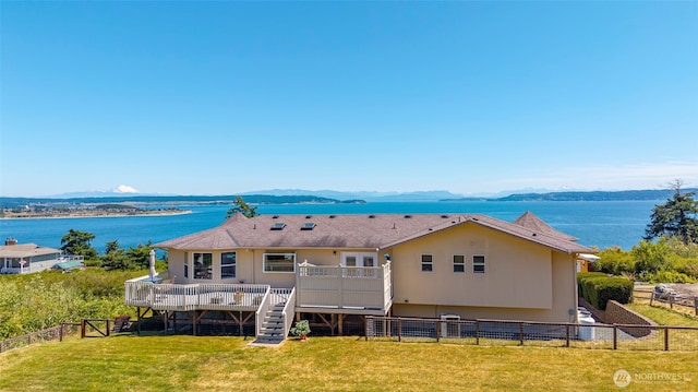 1223 Rainier Ln, Oak Harbor, WA 98277 - water view featuring stairway, a fenced backyard, and a mountainous background
