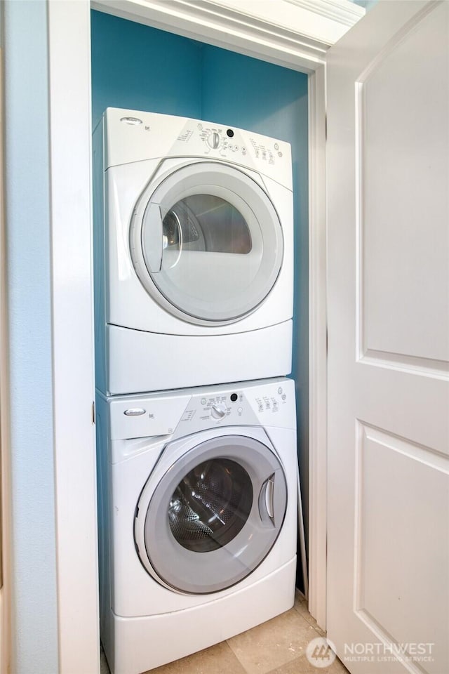 440 Marine View Dr SW Unit 3, Ocean Shores, WA 98569 - laundry room with stacked washer / drying machine and tile patterned flooring