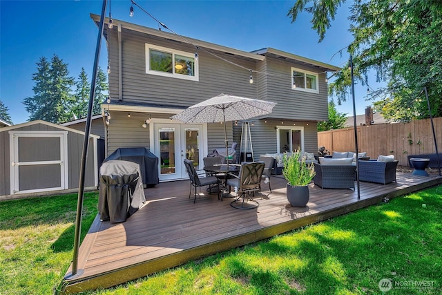 14305 109th Ave NE, Kirkland, WA 98034 - rear view of property featuring french doors, an outdoor living space, a storage shed, a wooden deck, and outdoor dining area