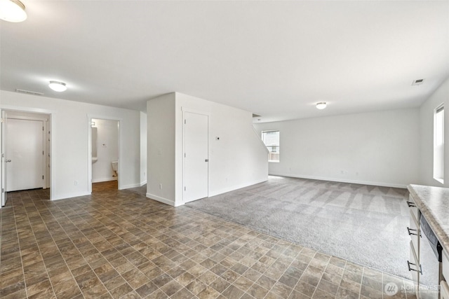29775 218th Pl SE, Kent, WA 98042 - unfurnished living room with stone finish floors and carpet flooring