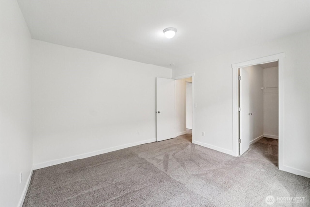 29775 218th Pl SE, Kent, WA 98042 - unfurnished bedroom featuring carpet flooring and a walk in closet