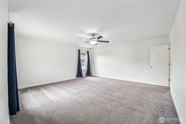 29775 218th Pl SE, Kent, WA 98042 - carpeted spare room with a ceiling fan and baseboards