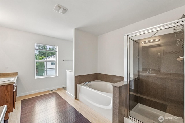 29775 218th Pl SE, Kent, WA 98042 - full bathroom featuring a bath, vanity, a shower stall, and wood finished floors