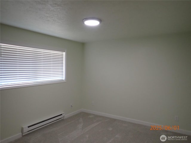 502504 4th St, Hoquiam, WA 98550 - unfurnished room with a baseboard radiator and carpet flooring