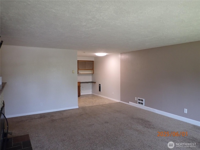 502504 4th St, Hoquiam, WA 98550 - unfurnished living room featuring a textured ceiling and carpet floors