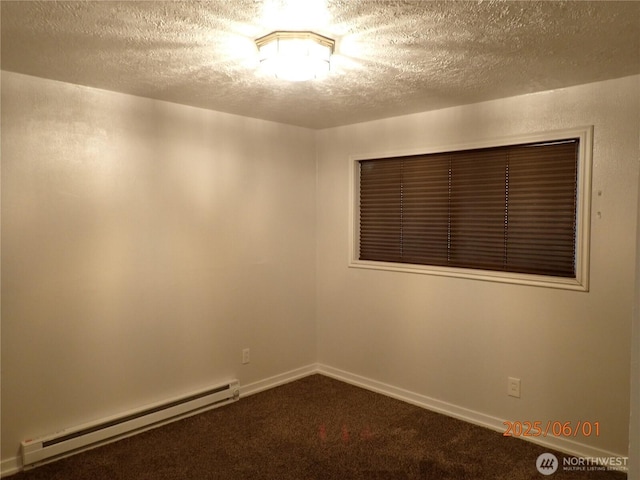 502504 4th St, Hoquiam, WA 98550 - carpeted spare room with a baseboard heating unit and a textured ceiling