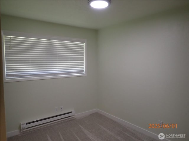 502504 4th St, Hoquiam, WA 98550 - empty room with baseboard heating and carpet flooring
