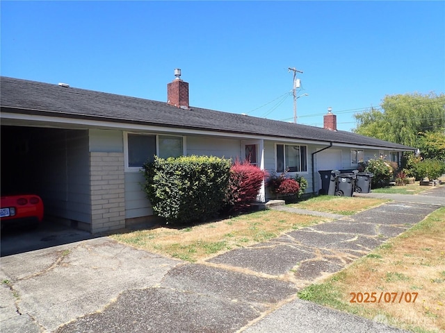 502504 4th St, Hoquiam, WA 98550 - view of front facade featuring a chimney and brick siding