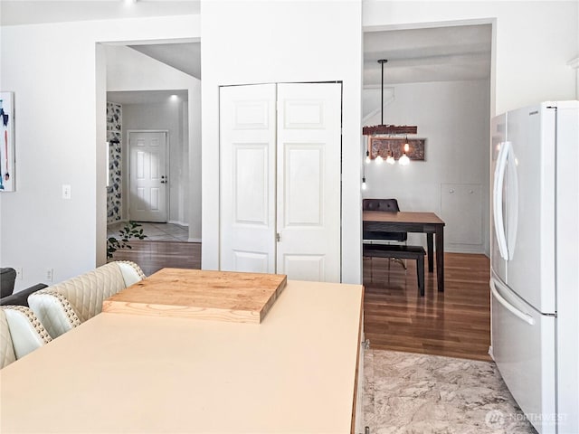 503 S 47th St Unit 11F, Renton, WA 98055 - kitchen with freestanding refrigerator and light wood-type flooring