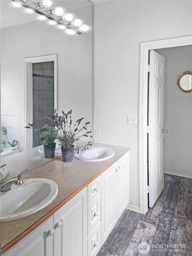 503 S 47th St Unit 11F, Renton, WA 98055 - bathroom featuring double vanity and wood finished floors