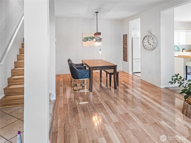 503 S 47th St Unit 11F, Renton, WA 98055 - dining area with stairs and light wood-type flooring