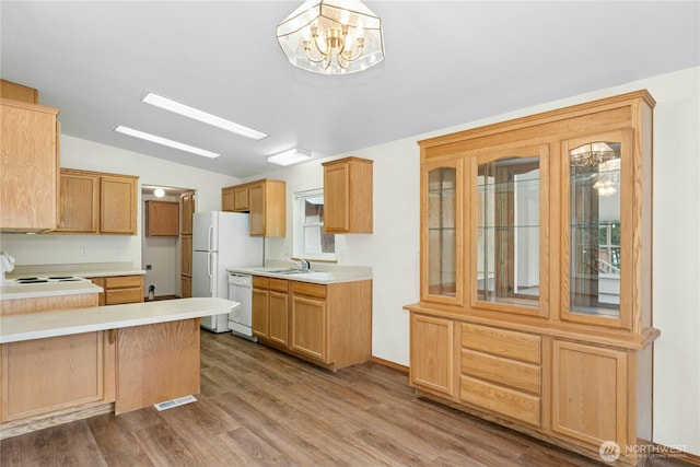1810 Casassa Rd, Cle Elum, WA 98922 - kitchen with dishwasher, lofted ceiling, dark wood-style flooring, a peninsula, and light countertops