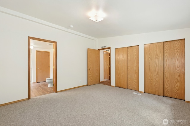 1810 Casassa Rd, Cle Elum, WA 98922 - unfurnished bedroom featuring two closets, carpet floors, and ensuite bath