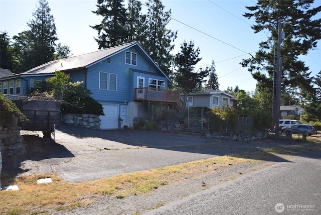 990 Madrona Way, Sequim, WA 98382 - view of front of property with an attached garage, driveway, and a metal roof