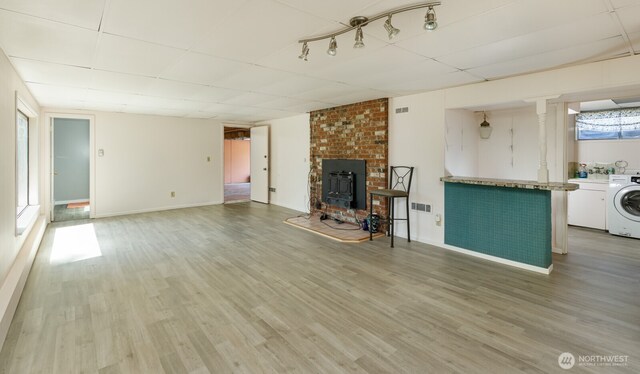1847 N 183rd St, Shoreline, WA 98133 - unfurnished living room with washer / dryer, a paneled ceiling, and light wood-type flooring