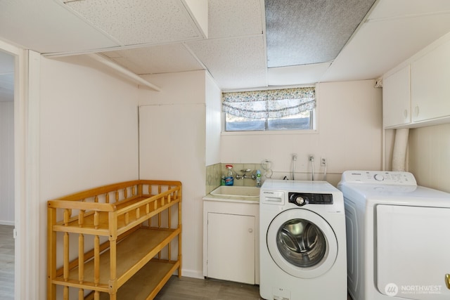 1847 N 183rd St, Shoreline, WA 98133 - laundry area featuring washing machine and dryer, dark wood-style floors, and cabinet space