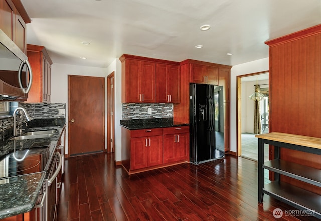 1847 N 183rd St, Shoreline, WA 98133 - kitchen with stainless steel appliances, dark brown cabinets, backsplash, dark wood-type flooring, and recessed lighting
