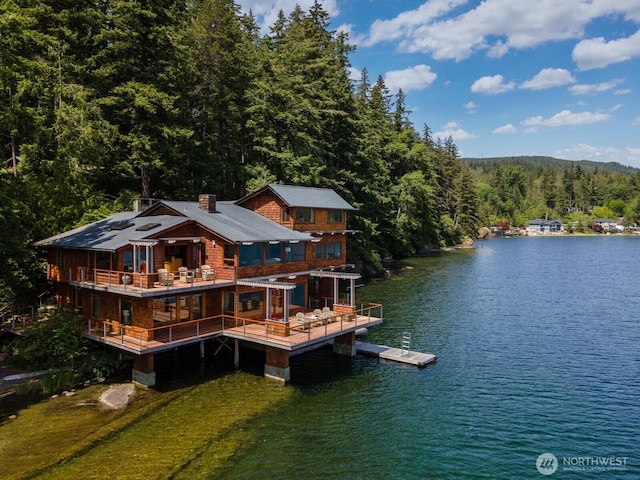 2247 Northshore Rd, Bellingham, WA 98226 - rear view of house featuring a forest view, a water view, and a chimney