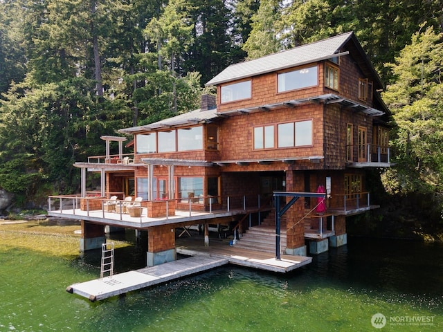 2247 Northshore Rd, Bellingham, WA 98226 - rear view of property featuring a forest view, a deck with water view, and roof with shingles