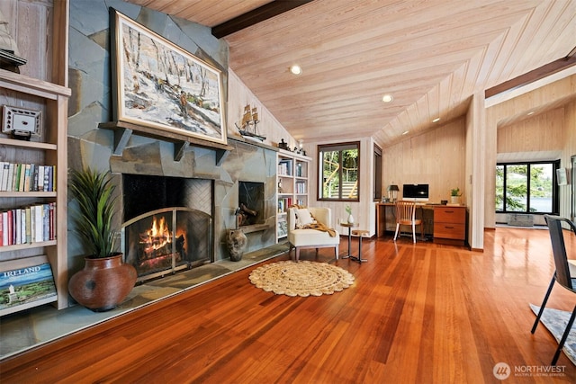 2247 Northshore Rd, Bellingham, WA 98226 - sitting room with wooden ceiling, wood finished floors, built in shelves, and a stone fireplace