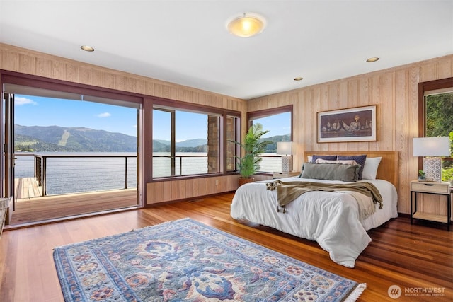 2247 Northshore Rd, Bellingham, WA 98226 - bedroom with access to exterior, a mountain view, wooden walls, and wood finished floors