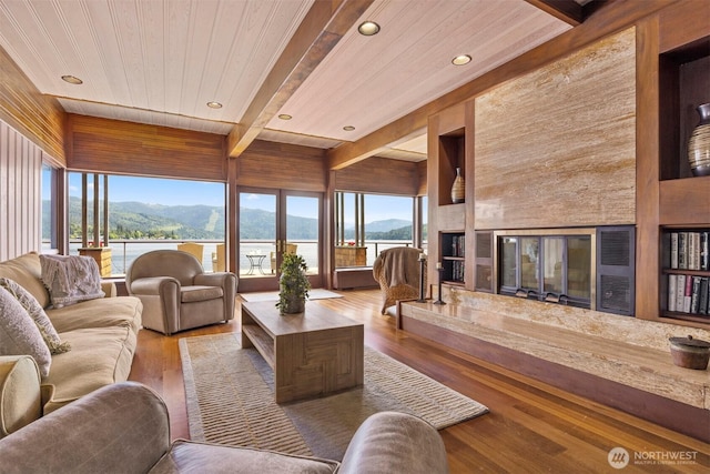 2247 Northshore Rd, Bellingham, WA 98226 - living room with a mountain view, plenty of natural light, recessed lighting, a wood ceiling with exposed beams, and wood finished floors